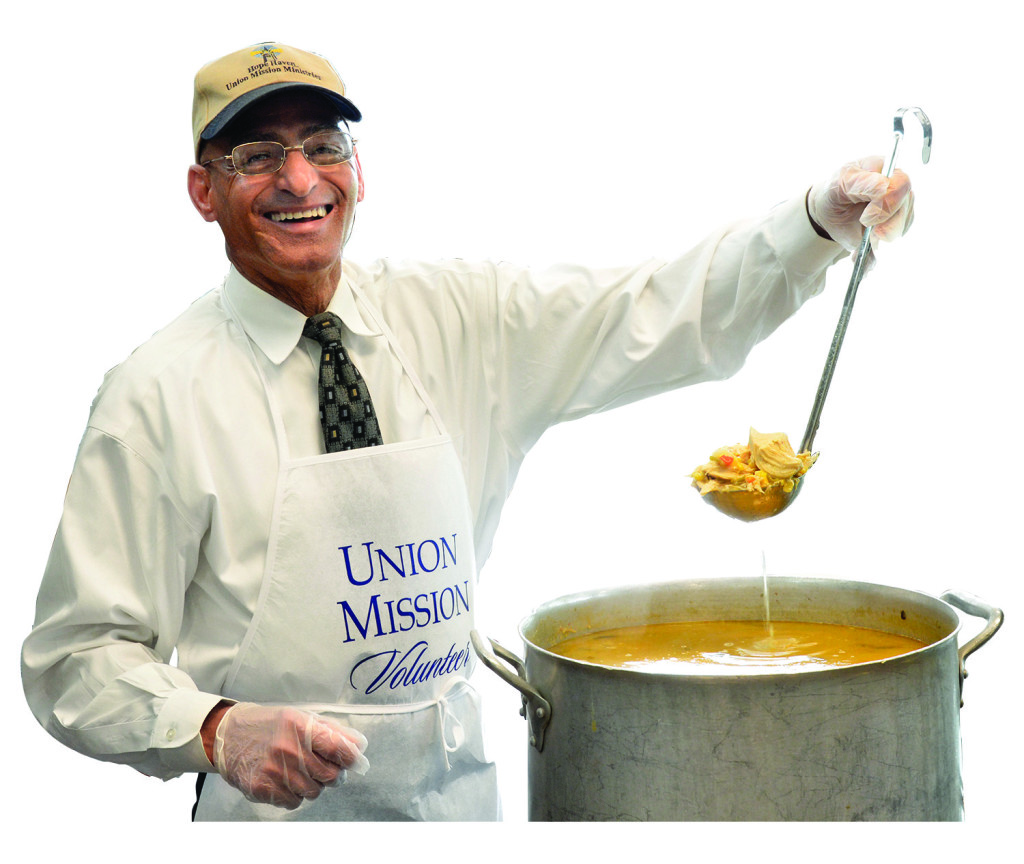 man serving soup